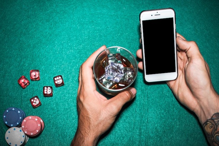 Boom City live dealer studio interface on mobile phone showing baccarat table